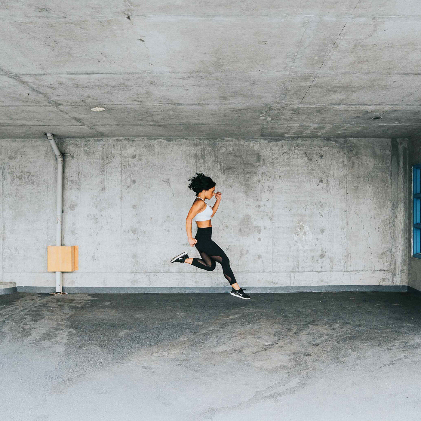 Fitness girl jumping in place 