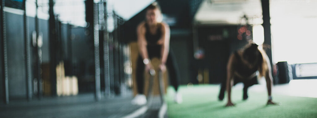 Fuzzy image of gym members ready to run